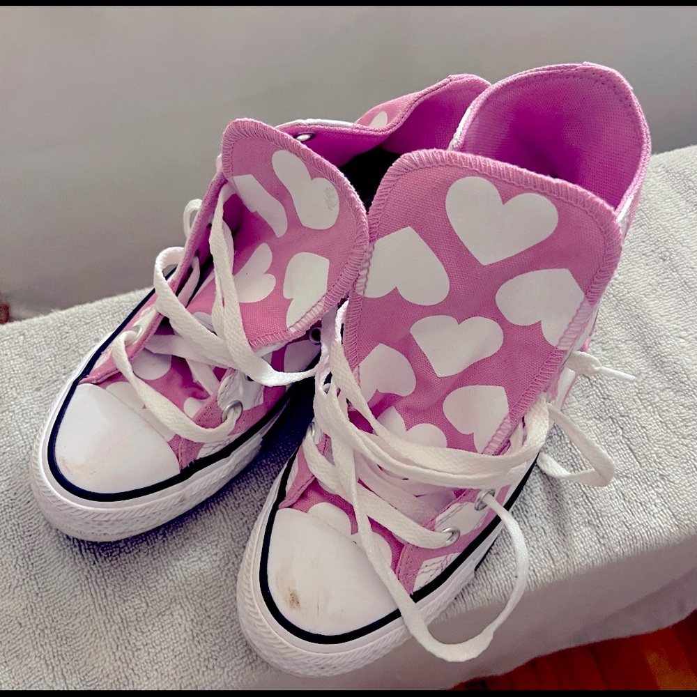 All pink Converse with White heart pattern. Send me an offer. I still have these